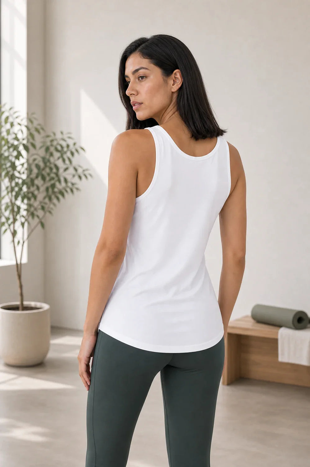 HER FEMME FIT model side view wearing White V-Neck Active Tank