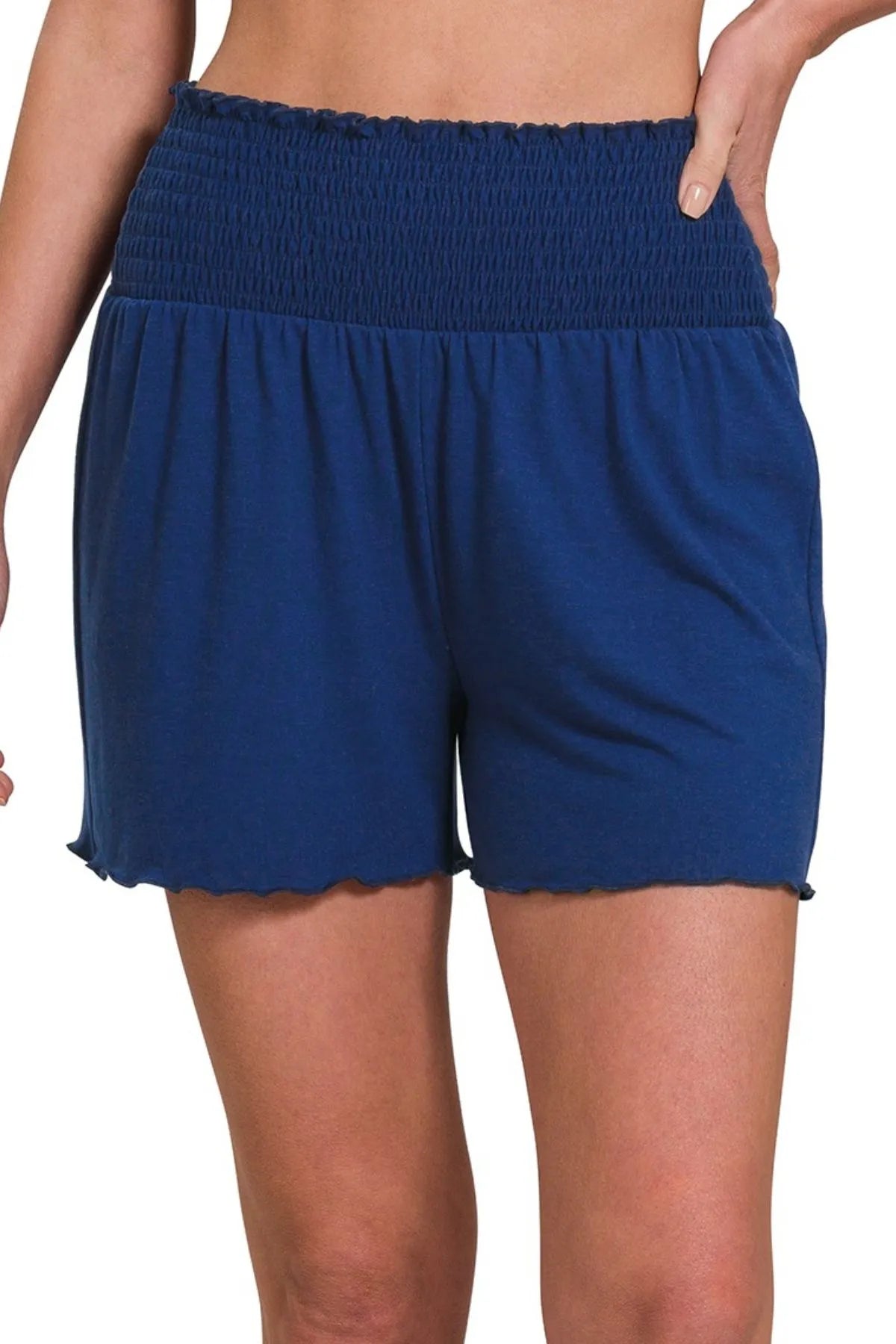 Woman wearing the Her Femme Fit Smocked Waist Everyday Shorts in Navy