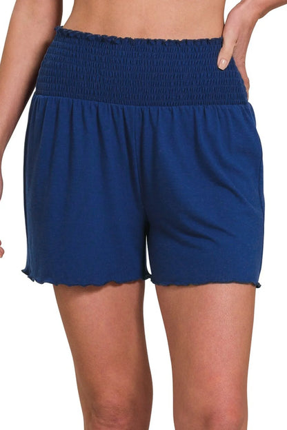 Woman wearing the Her Femme Fit Smocked Waist Everyday Shorts in Navy