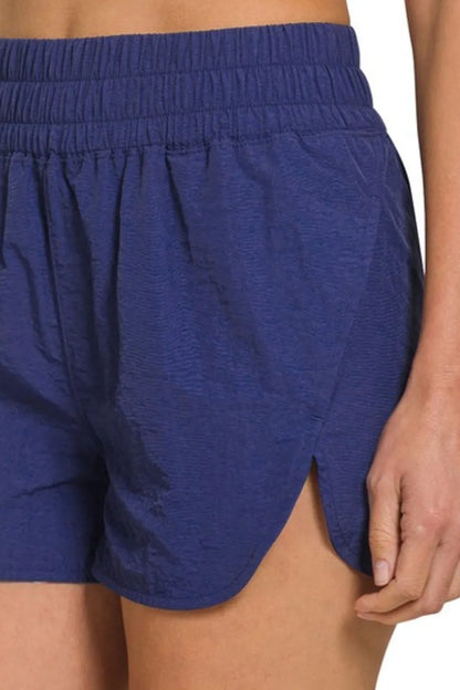 Her Femme Fit Windbreaker Running Shorts in Navy, detail view 2