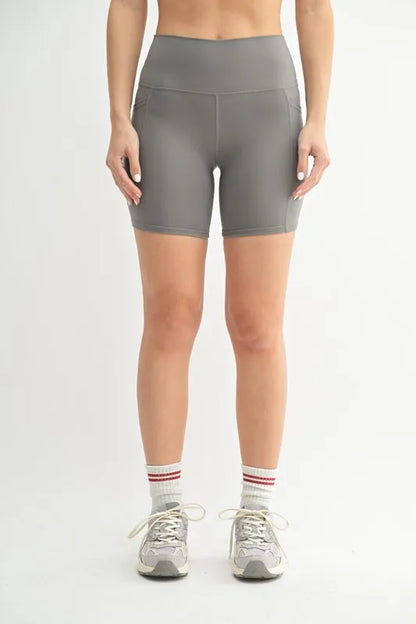 Woman wearing the Her Femme Fit Cloud Sculpt Biker Shorts in Pewter