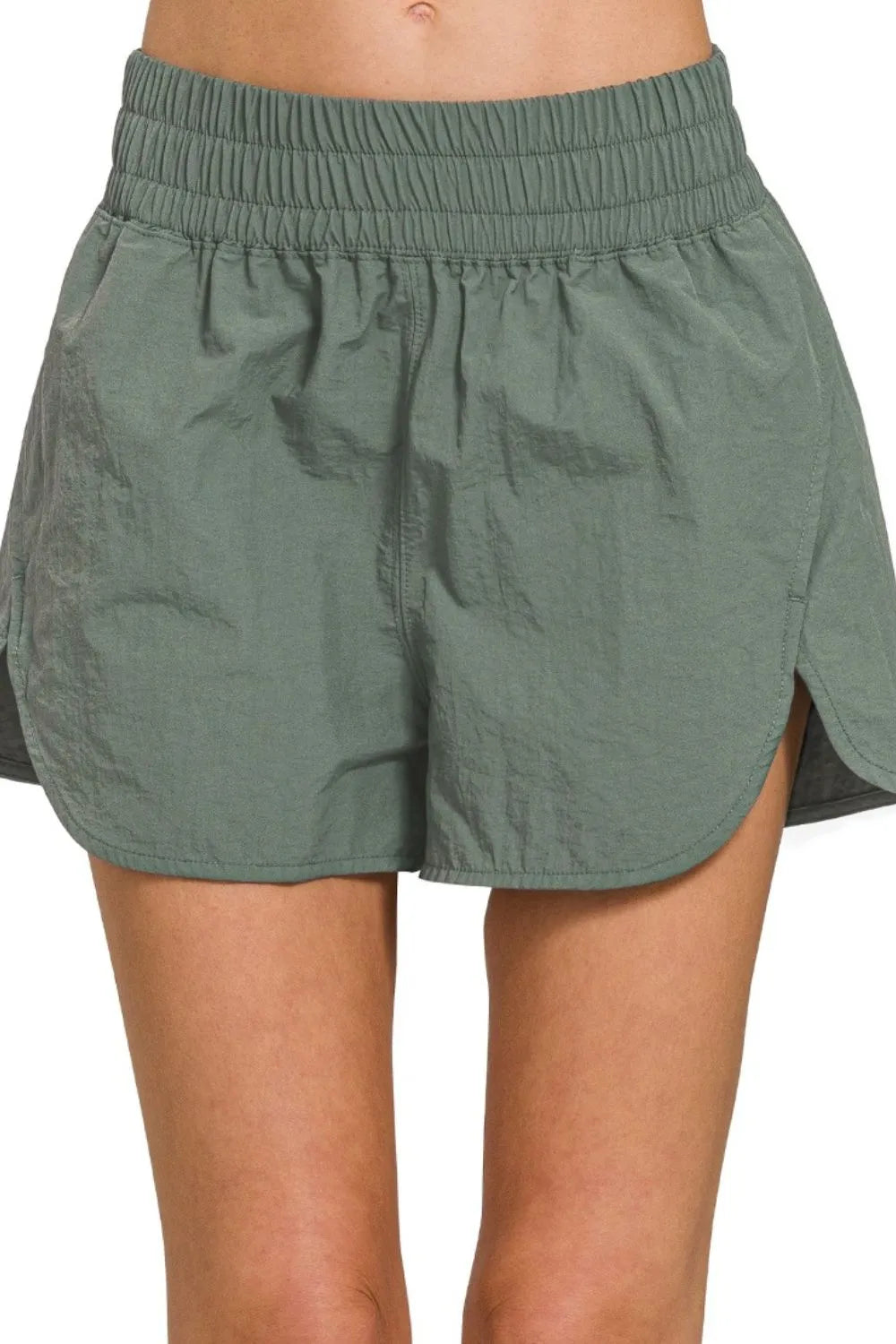 Woman wearing the Her Femme Fit Windbreaker Running Shorts in Ash Jade