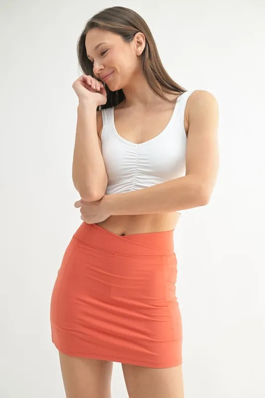 Woman wearing the Her Femme Fit Ruched Front Active Tank in White