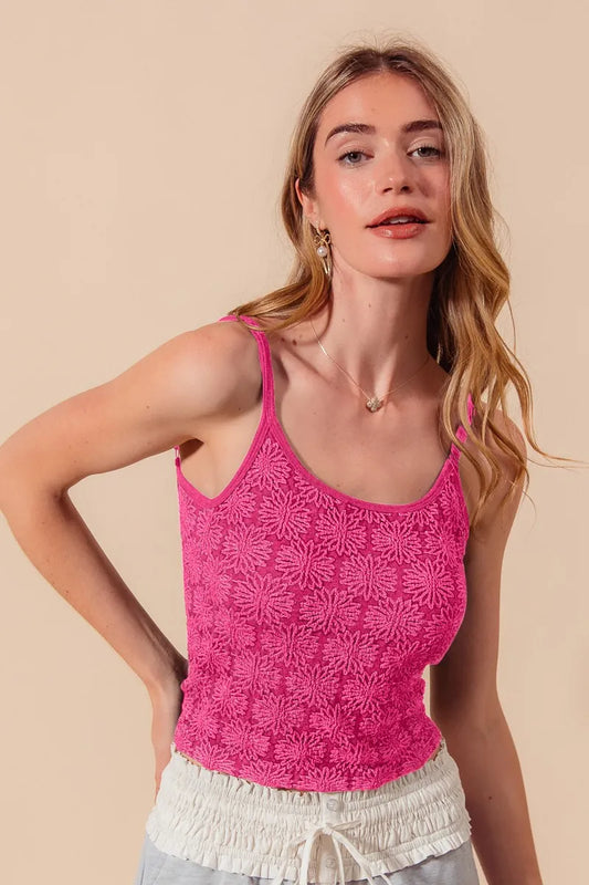 Woman wearing the Her Femme Fit Floral Perforated Seamless Tank in Fuchsia