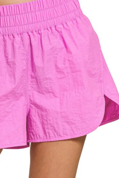 Her Femme Fit Windbreaker Running Shorts in Bright Mauve, detail view 2
