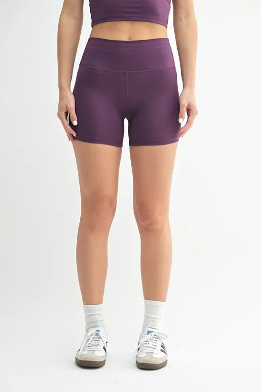 Woman wearing the Her Femme Fit Cloud Sculpt Contour Biker Shorts in Merlot