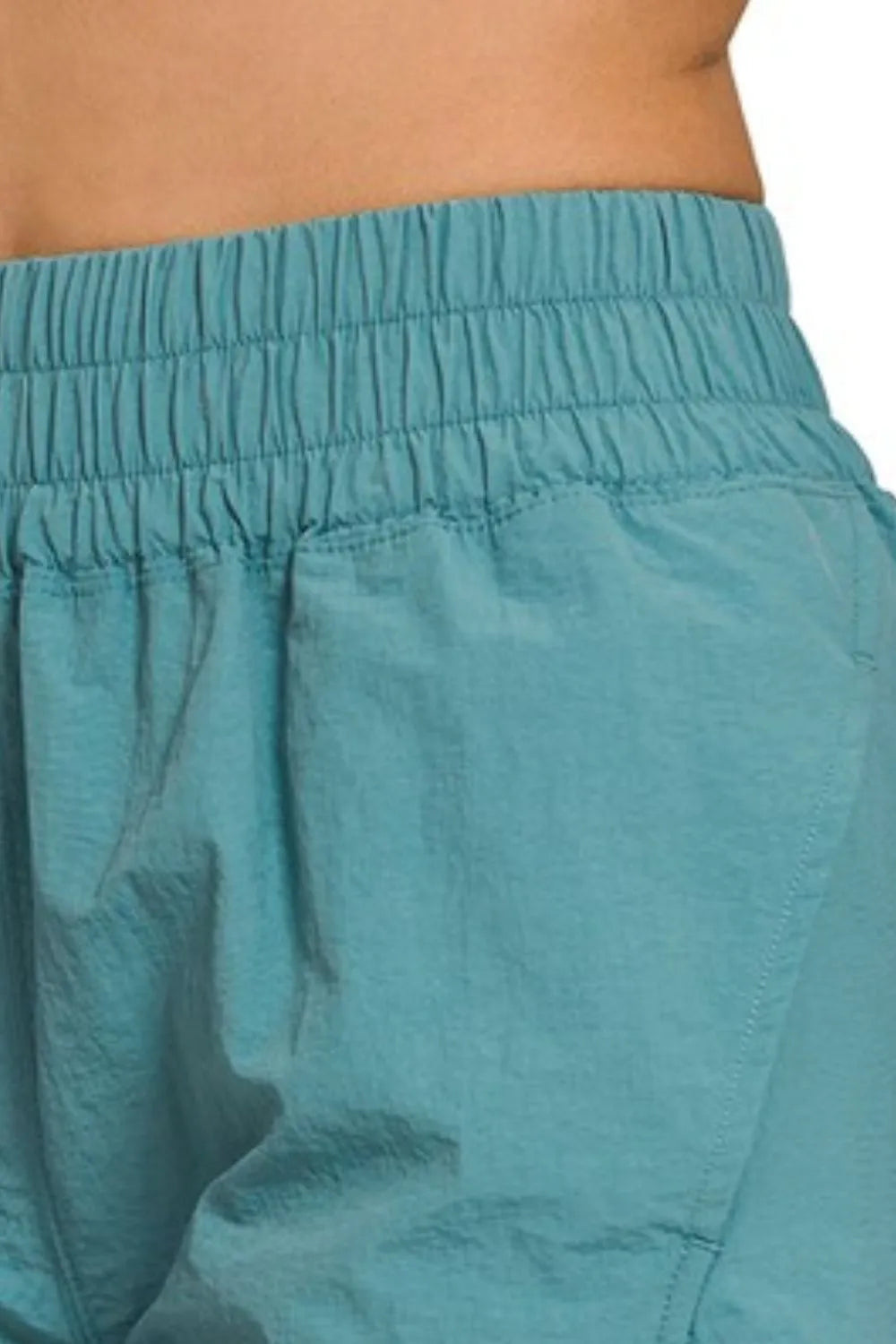 Her Femme Fit Windbreaker Running Shorts in Dusty Teal, detail view 2