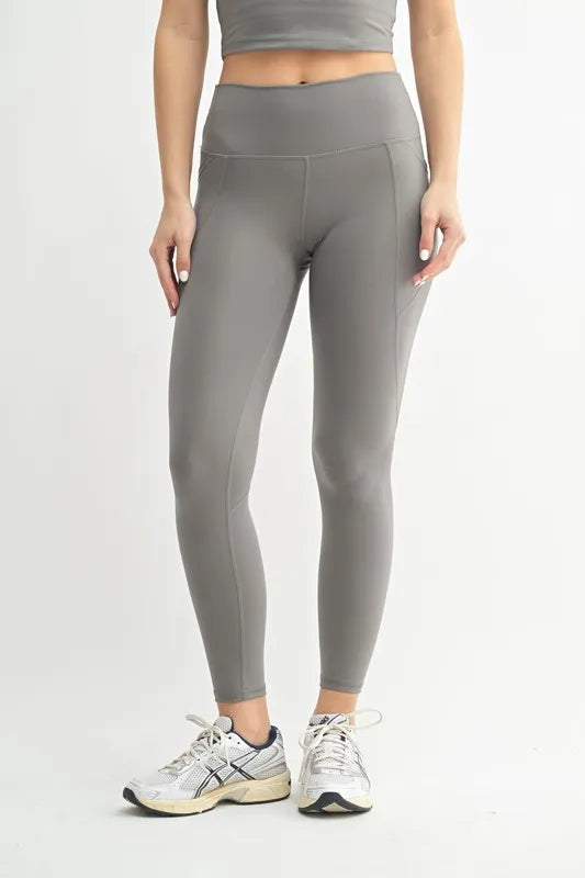 Woman wearing the Her Femme Fit Cloud Sculpt High-Rise Leggings in Pewter