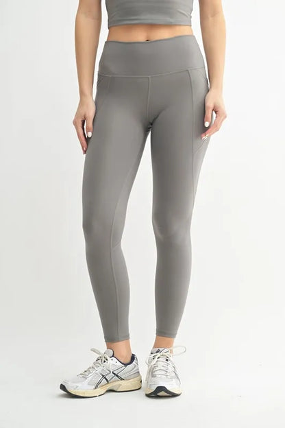 Woman wearing the Her Femme Fit Cloud Sculpt High-Rise Leggings in Pewter